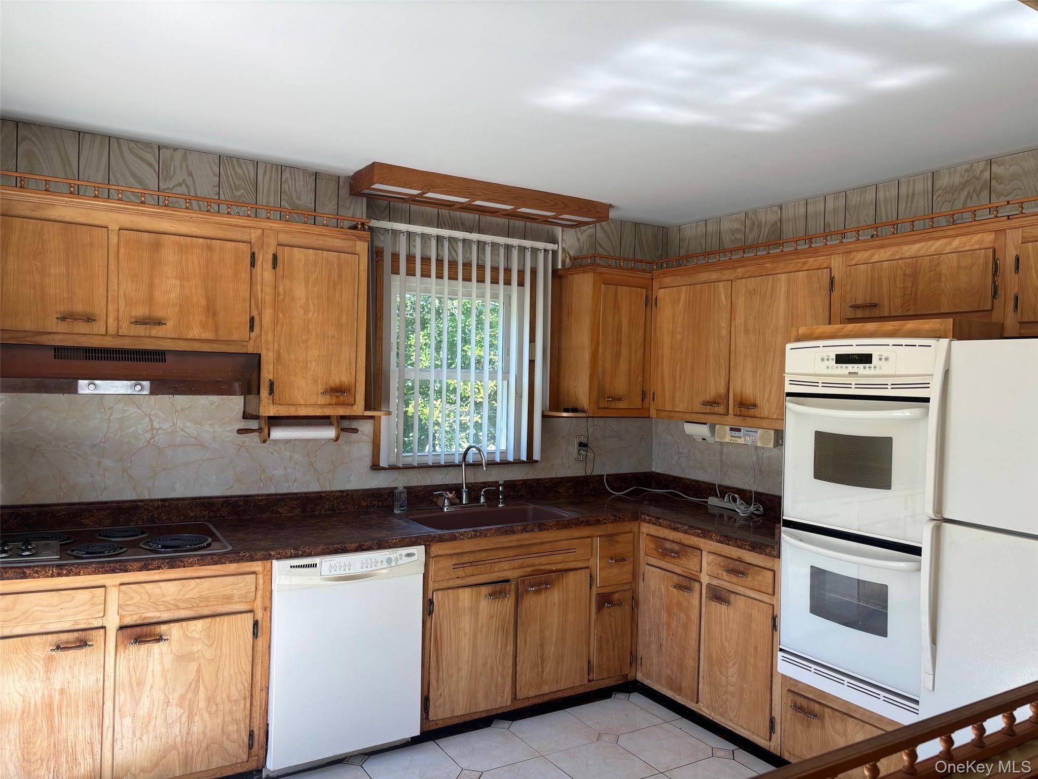 10 13th Avenue West Babylon, NY 11704 - Photo 8 of 33 a kitchen with granite countertop a sink and a stove