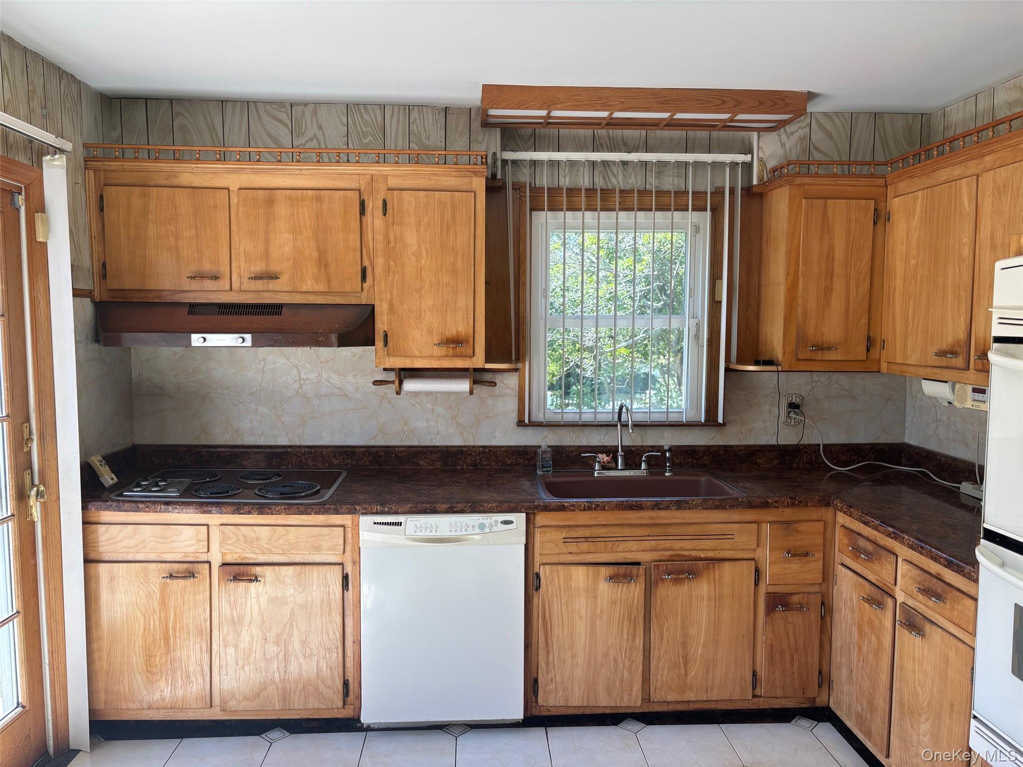 10 13th Avenue West Babylon, NY 11704 - Photo 9 of 33 a kitchen with granite countertop a sink and a stove