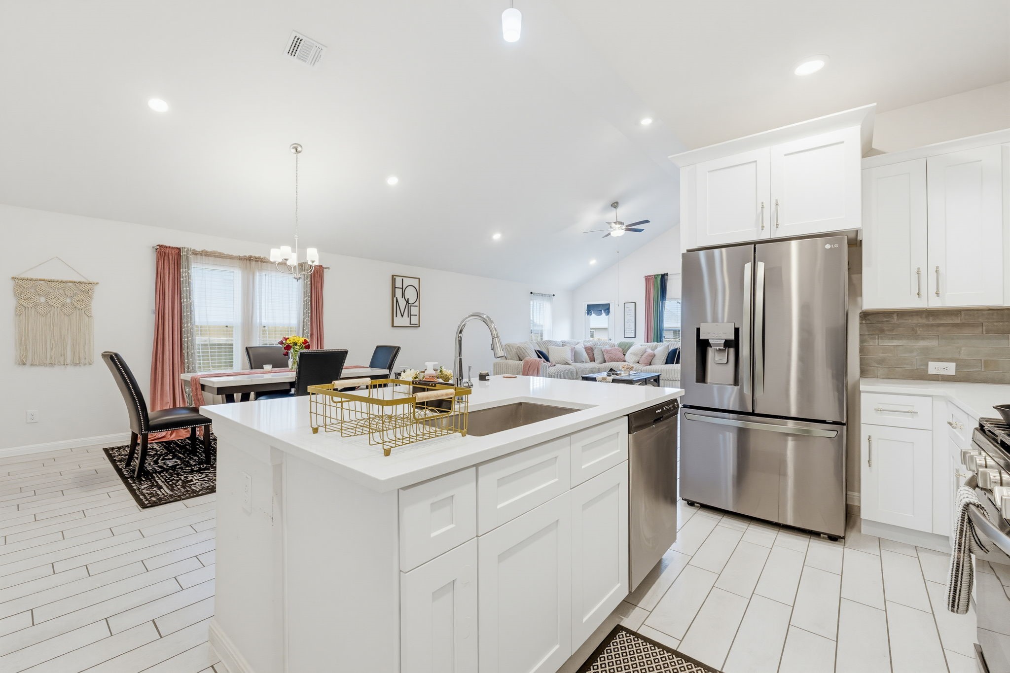 316 Windstar Road Liberty Hill, TX 78642 - Photo 6 of 27 a kitchen with a refrigerator a stove a microwave and a counter top space