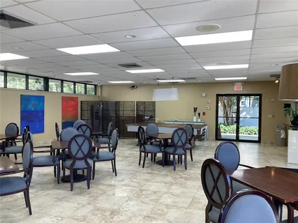 a view of a dining room with furniture window and outdoor seating