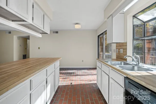 a bathroom with a sink a vanity and a large mirror