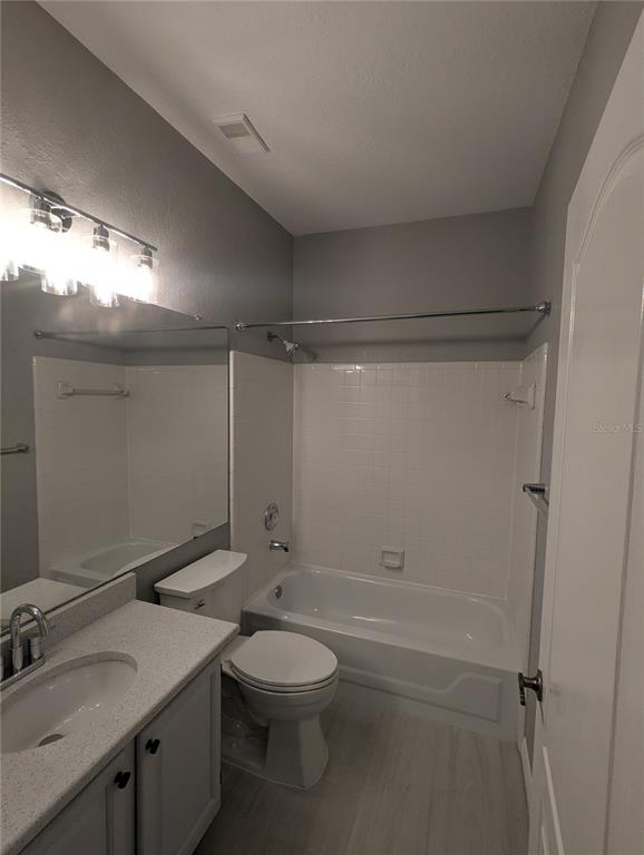 903 Normandy Trace Road Tampa, FL 33602 - Photo 11 of 14 a bathroom with a sink a toilet and shower