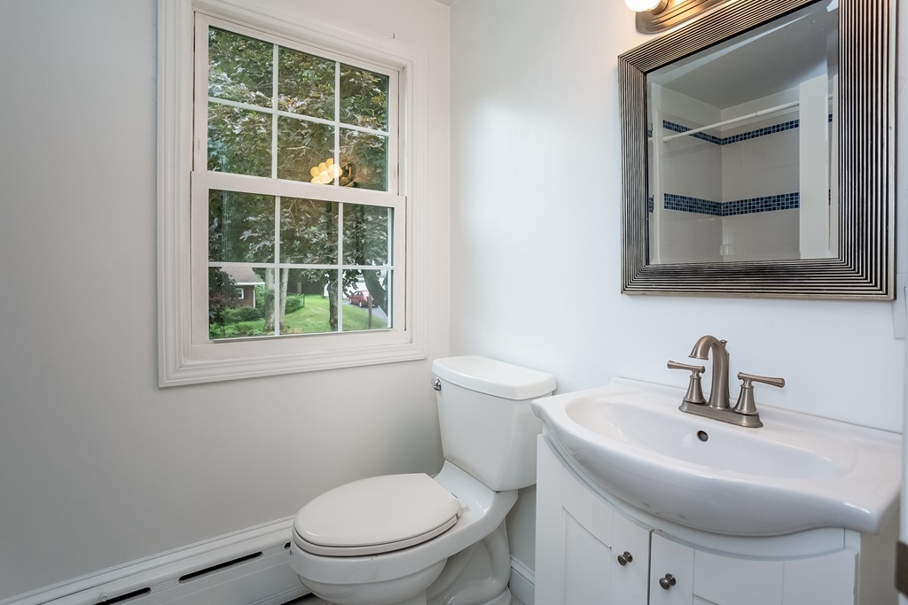 58 Robin Road Longmeadow, MA 01106 - Photo 22 of 30 a bathroom with a toilet a sink and a window