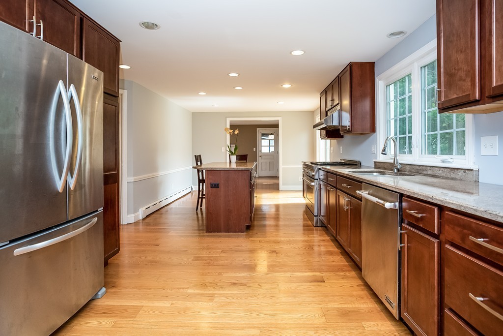 58 Robin Road Longmeadow, MA 01106 - Photo 9 of 30 a large kitchen with stainless steel appliances granite countertop a refrigerator and a sink