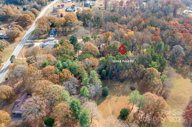 a living room filled with furniture and a chandelier