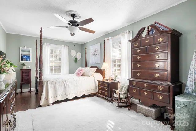 a bedroom with a bed and a large mirror