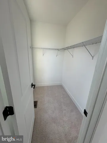 a view of a room with racks on the wall