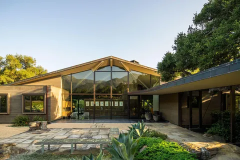 a view of a chair and table in the patio