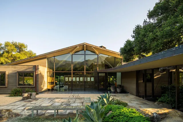 a view of a chair and table in the patio