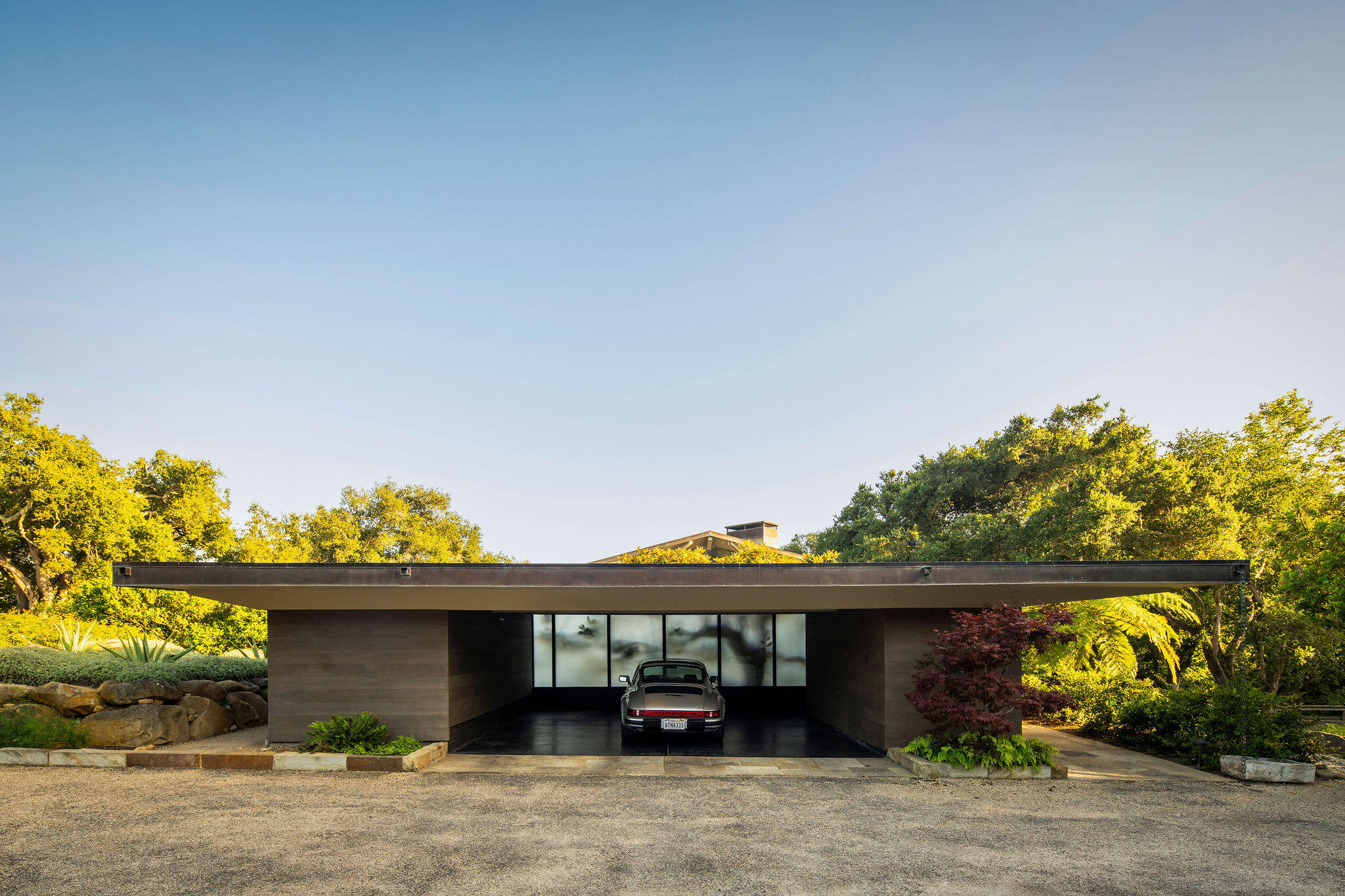 650 San Ysidro Road Montecito, CA 93108 - Photo 11 of 54 a front view of a house with a garden