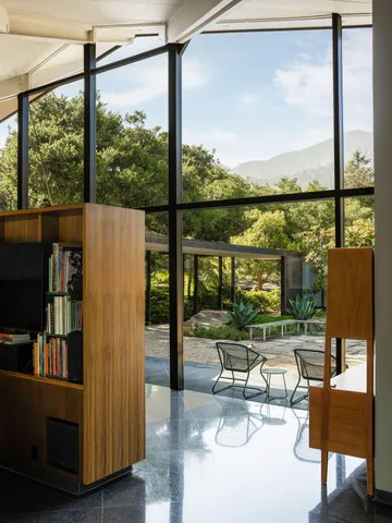 a view of a kitchen with furniture and windows