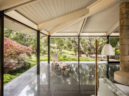 a view of a dining room with furniture window and outside view