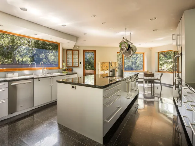 a kitchen with a stove and cabinets