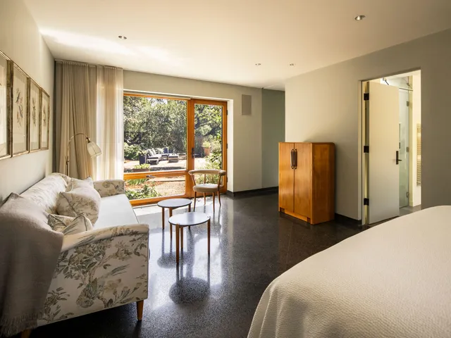 a view of a bathroom with a table and chair