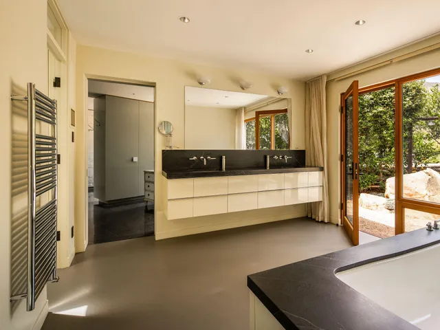 a room with furniture and a large window