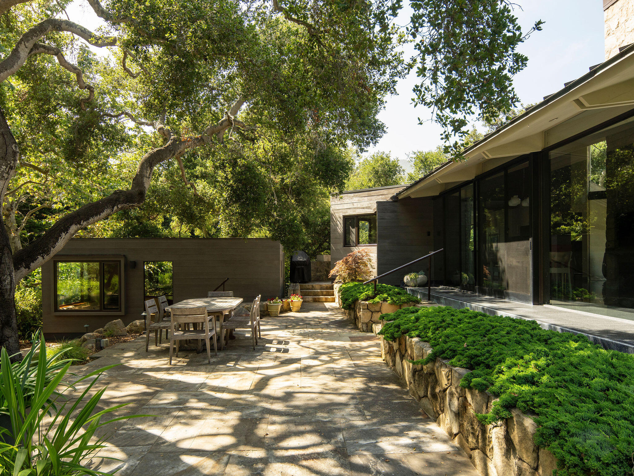 650 San Ysidro Road Montecito, CA 93108 - Photo 33 of 54 a backyard of a house with yard and outdoor seating