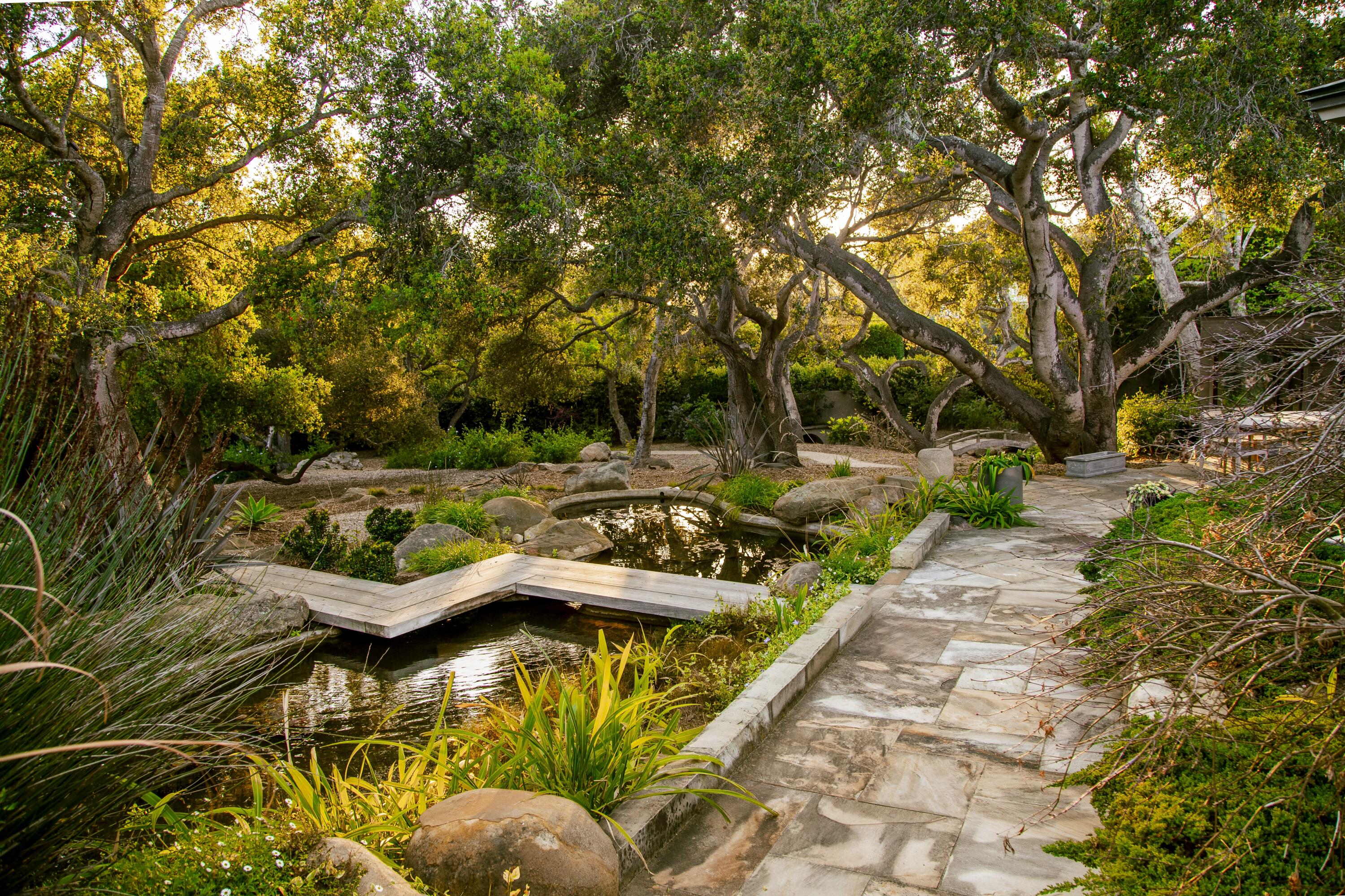 650 San Ysidro Road Montecito, CA 93108 - Photo 34 of 54 a view of swimming pool with lawn chairs and plants