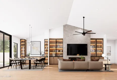 a living room with furniture a flat screen tv and a window