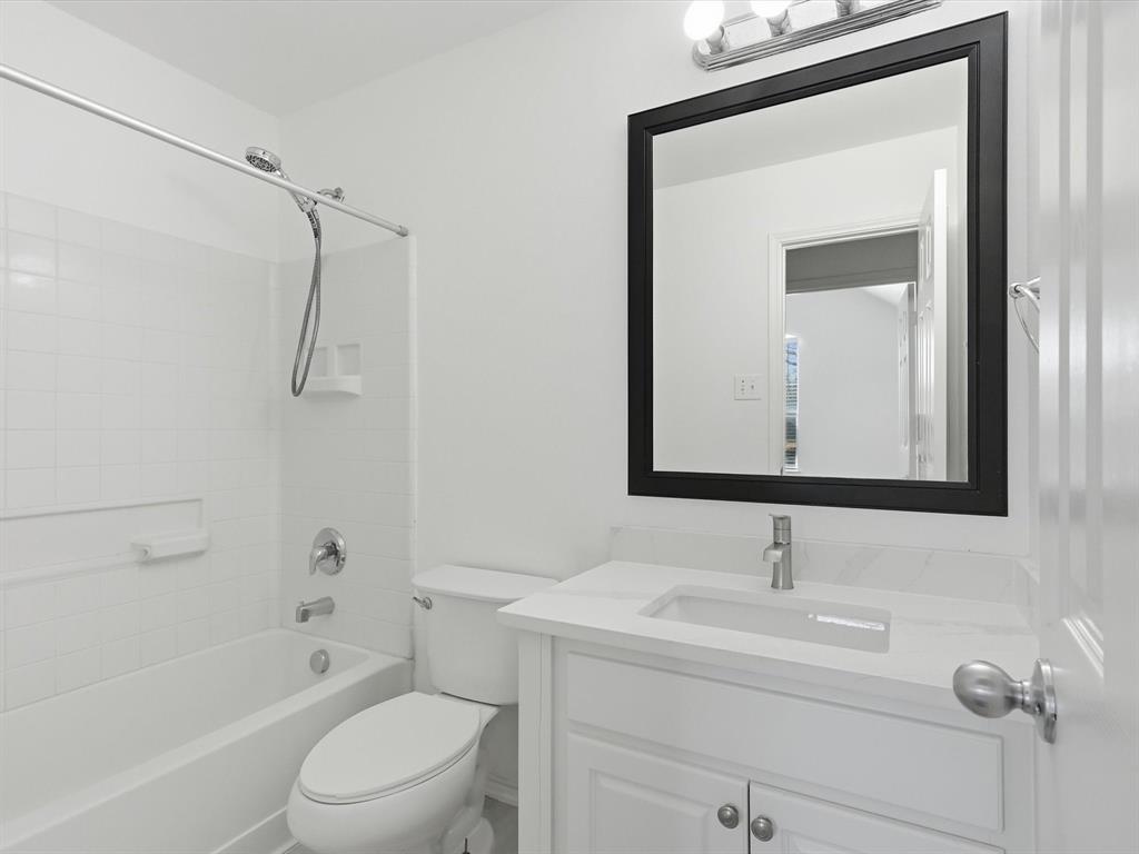 424 Shady Shore Lane Crowley, TX 76036 - Photo 11 of 40 a bathroom with a sink a toilet and shower