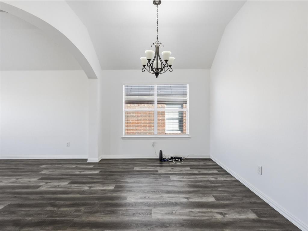 424 Shady Shore Lane Crowley, TX 76036 - Photo 19 of 40 a view of a room with window ceiling fan and wooden floor