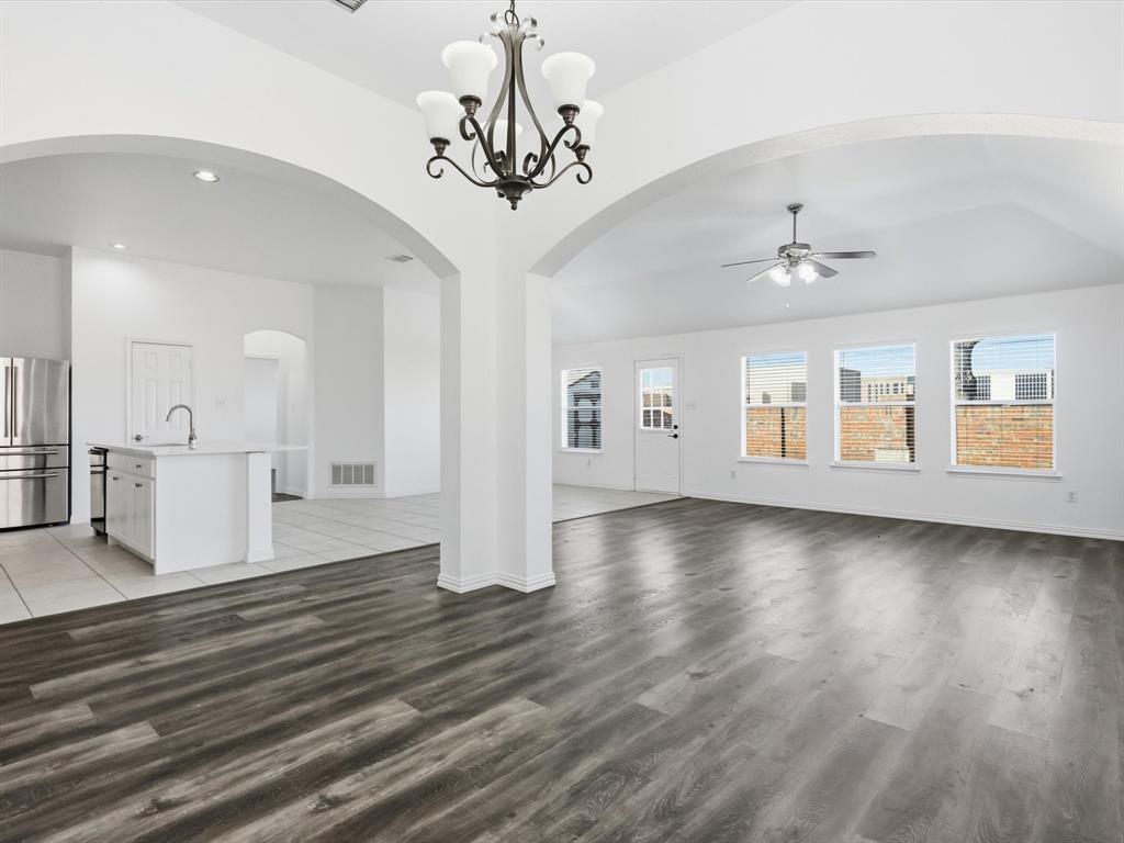 424 Shady Shore Lane Crowley, TX 76036 - Photo 20 of 40 a view of a livingroom with wooden floor and a kitchen