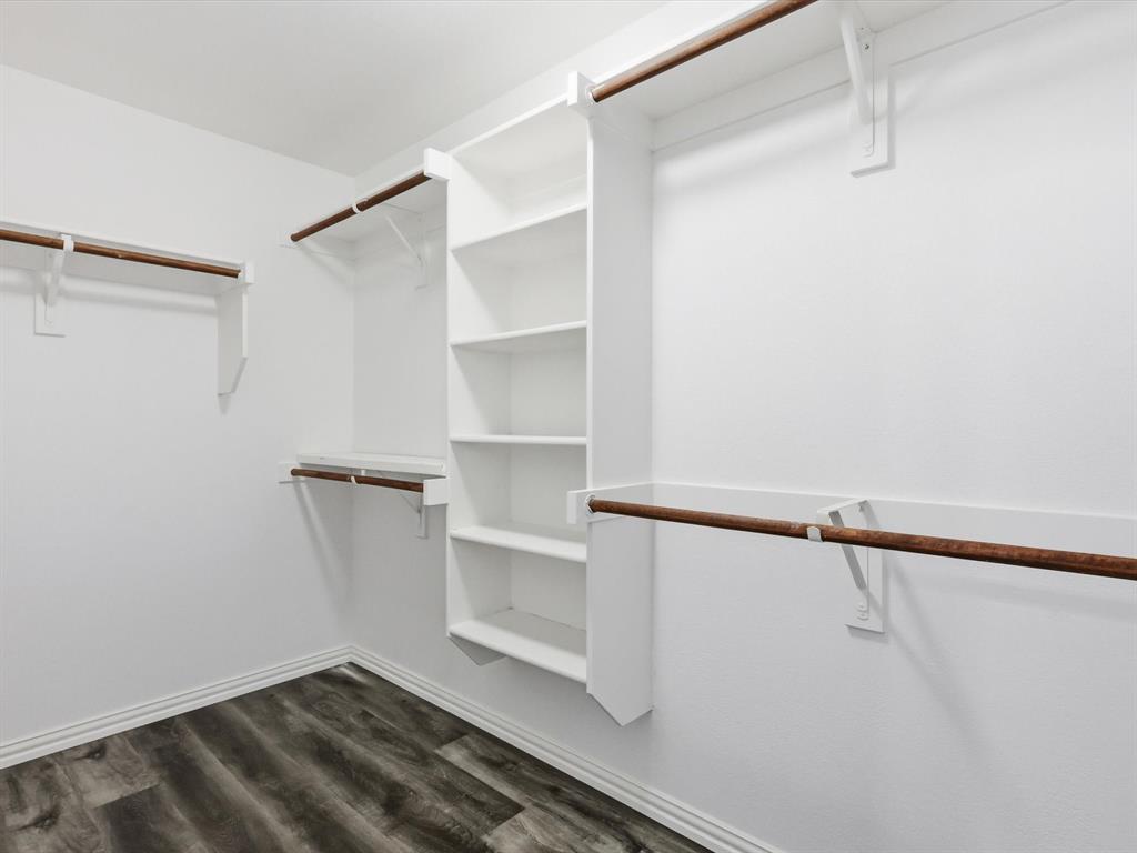 424 Shady Shore Lane Crowley, TX 76036 - Photo 30 of 40 a view of walk in closet with empty racks