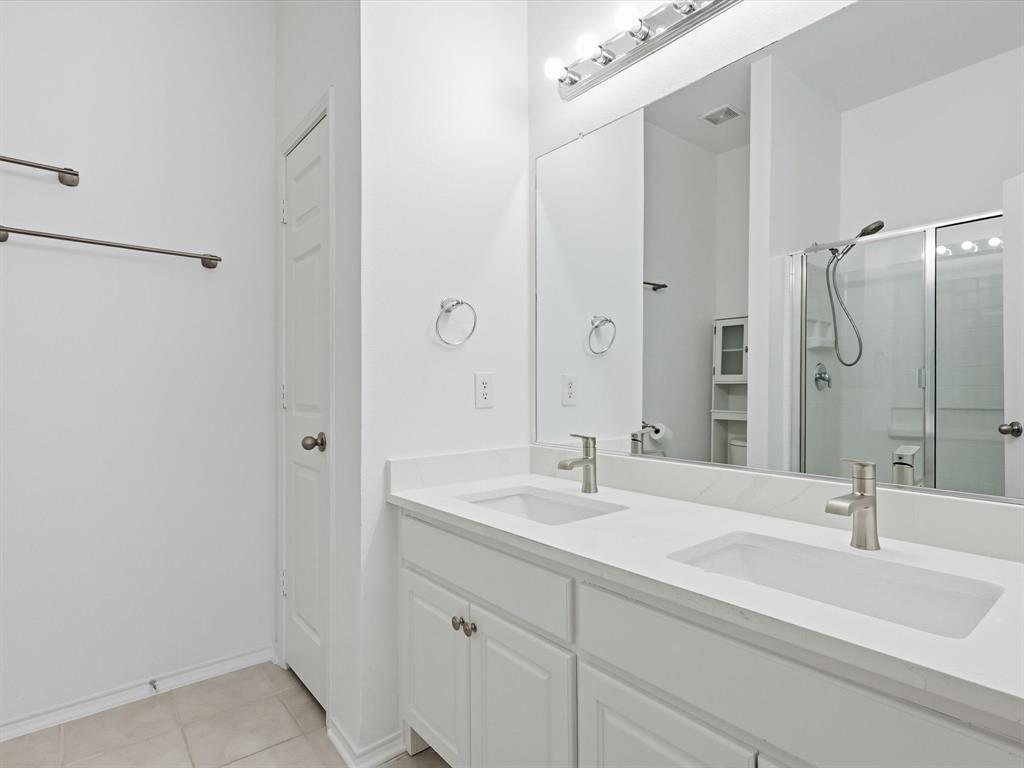 424 Shady Shore Lane Crowley, TX 76036 - Photo 31 of 40 a bathroom with a double vanity sink mirror and double