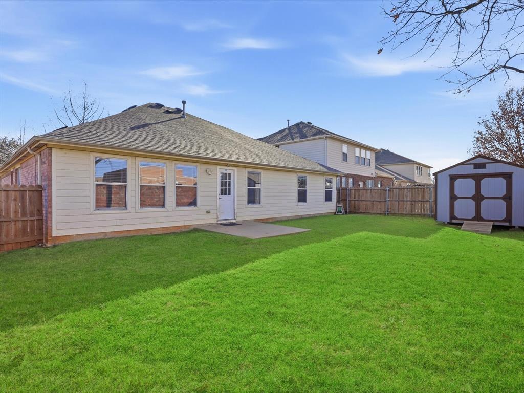 424 Shady Shore Lane Crowley, TX 76036 - Photo 36 of 40 a front view of a house with a garden