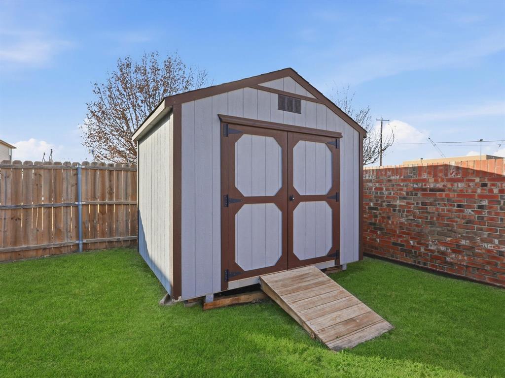 424 Shady Shore Lane Crowley, TX 76036 - Photo 37 of 40 a front view of a house with garden