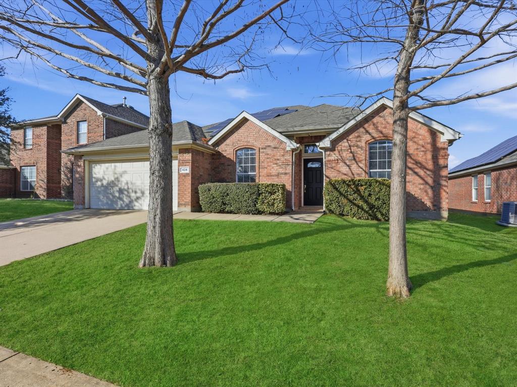 424 Shady Shore Lane Crowley, TX 76036 - Photo 4 of 40 a front view of a house with a yard