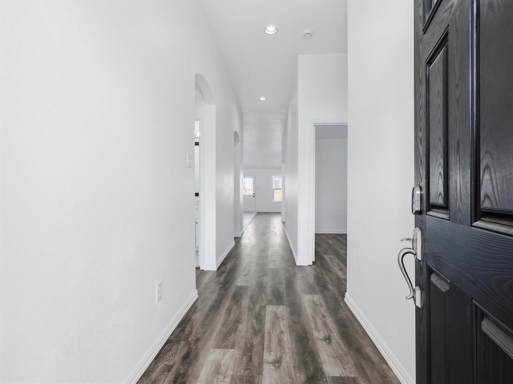 424 Shady Shore Lane Crowley, TX 76036 - Photo 7 of 40 a view of a hallway with wooden floor