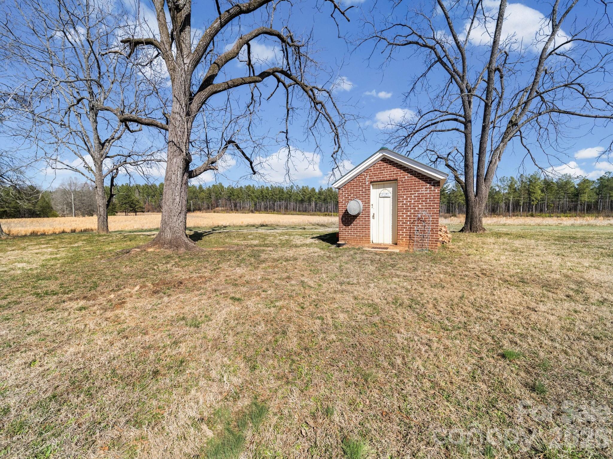 1347 Newsom Road Denton, NC 27239 - Photo 12 of 47 a house that has a tree in front of it