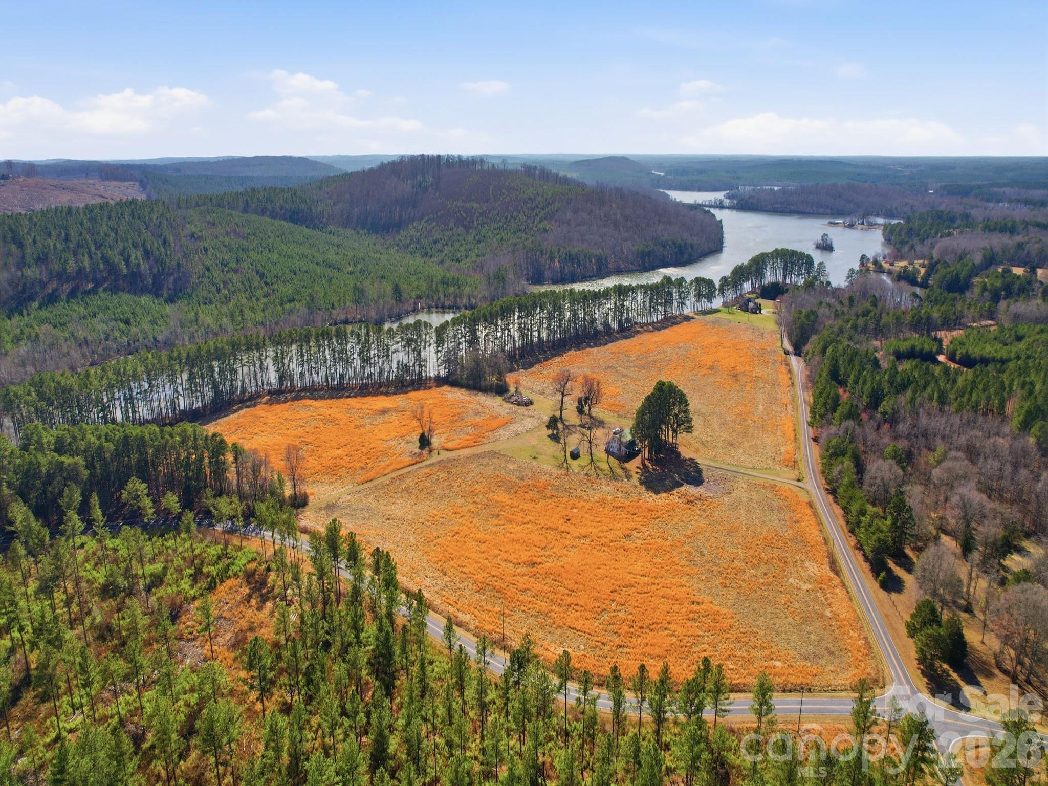1347 Newsom Road Denton, NC 27239 - Photo 16 of 47 a view of a swimming pool with a yard