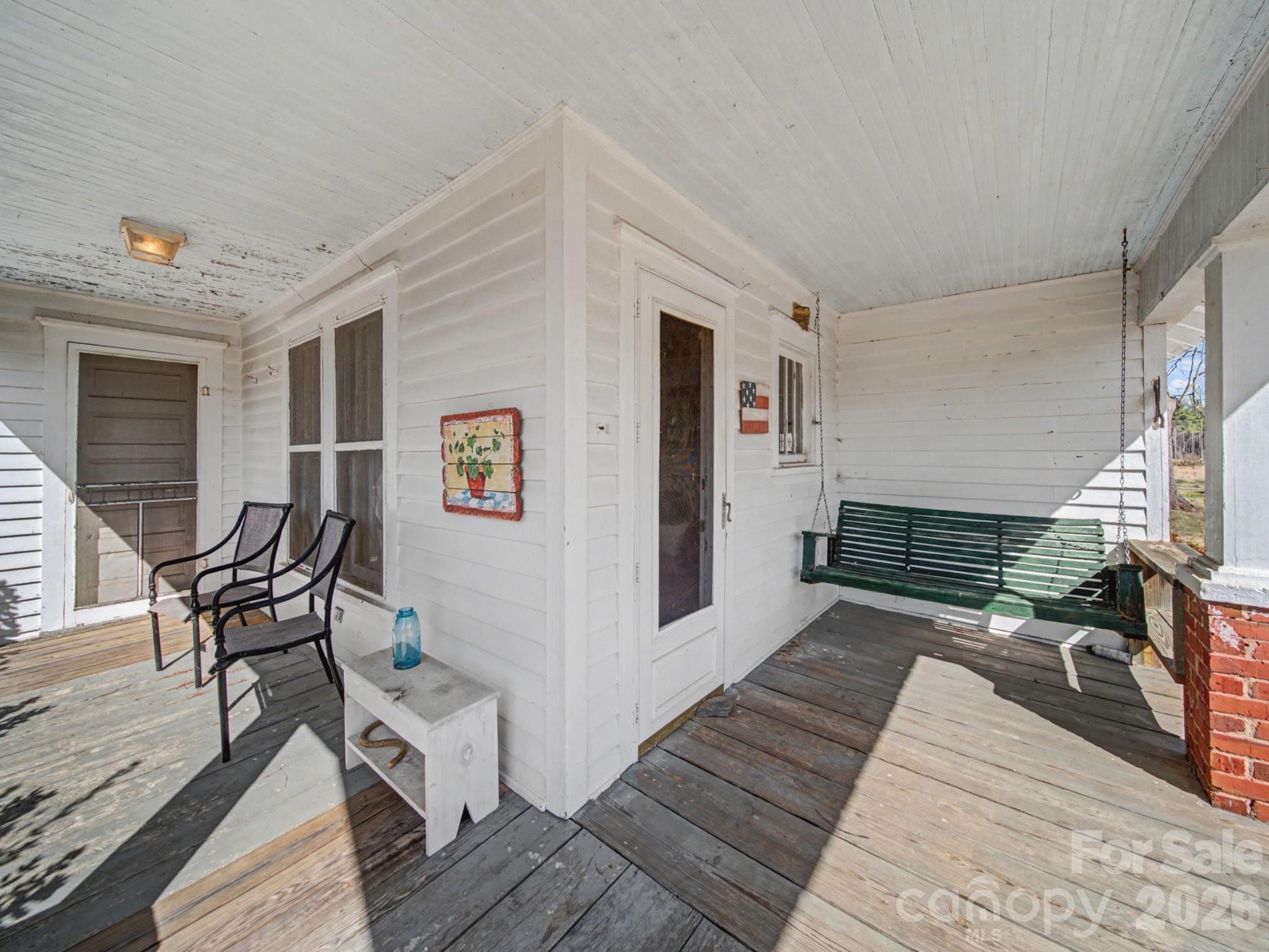1347 Newsom Road Denton, NC 27239 - Photo 17 of 47 a hallway with wooden floor and furniture