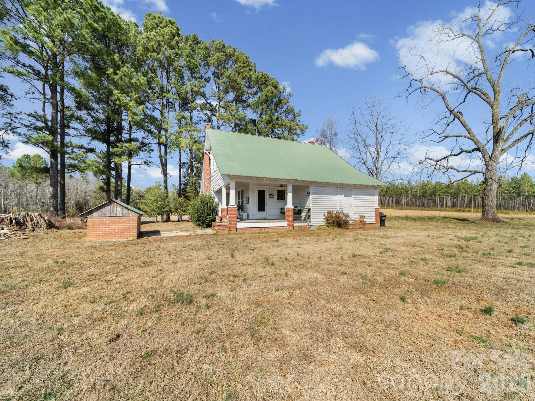 1347 Newsom Road Denton, NC 27239 - Photo 18 of 47 a view of a house with a yard