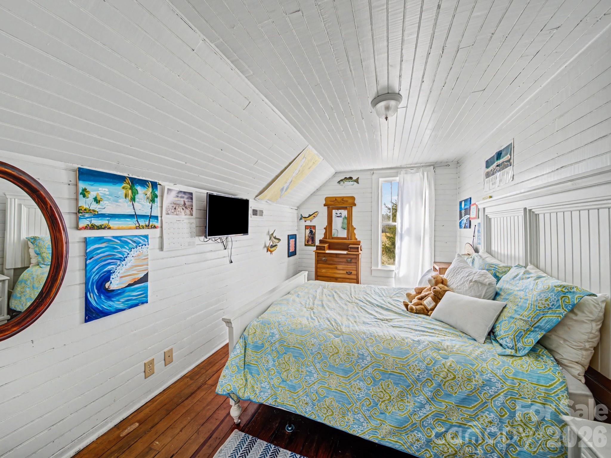 1347 Newsom Road Denton, NC 27239 - Photo 31 of 47 a bedroom with a bed and wooden floor