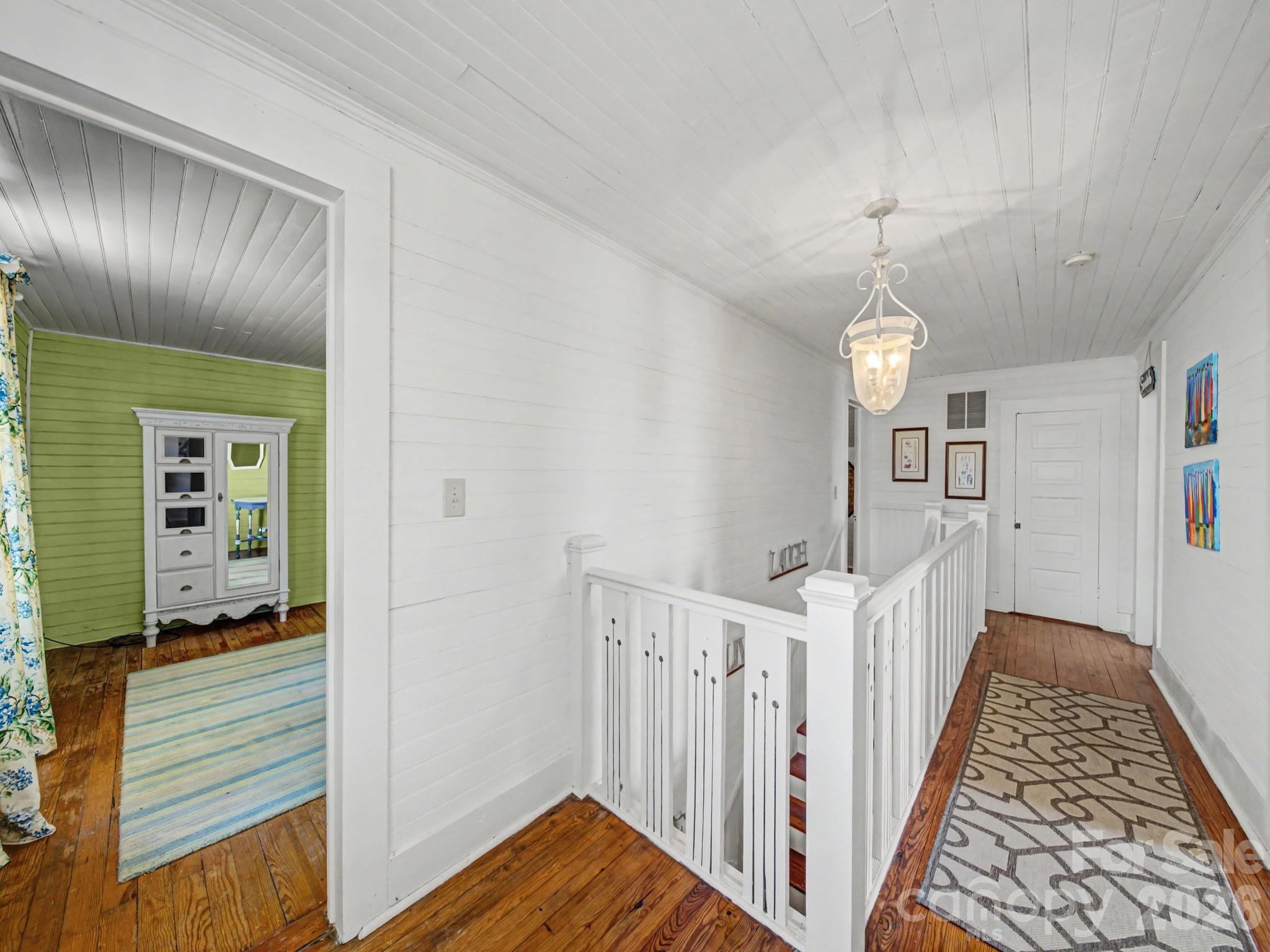 1347 Newsom Road Denton, NC 27239 - Photo 33 of 47 a view of a hallway with wooden floor and stairs