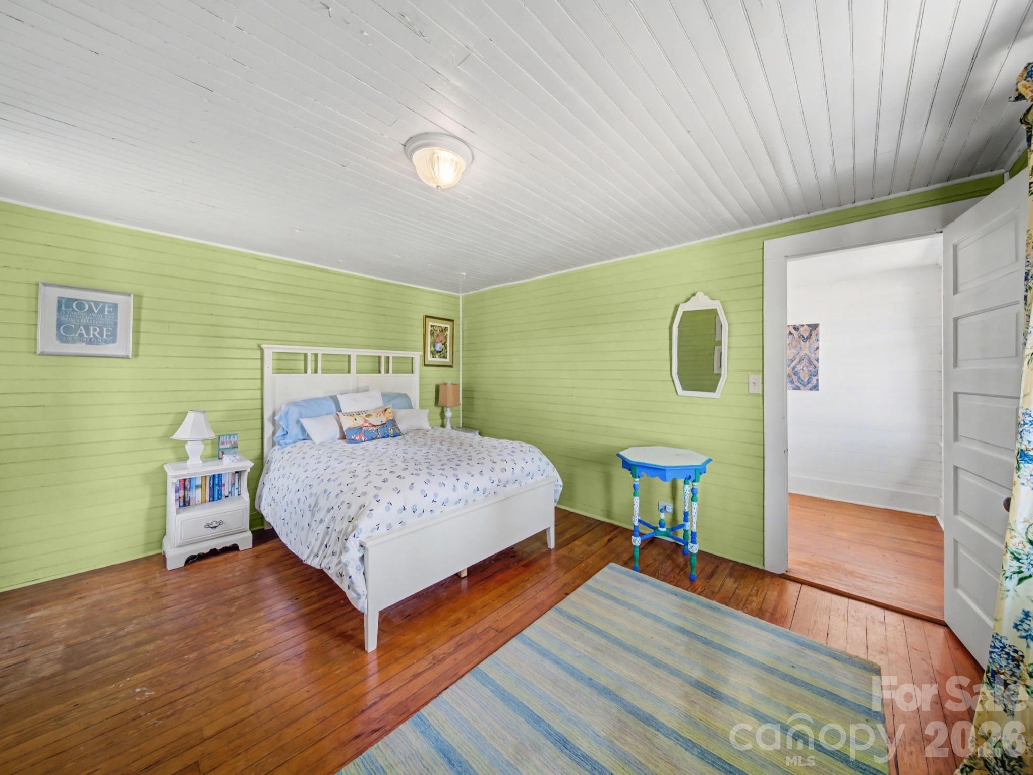 1347 Newsom Road Denton, NC 27239 - Photo 34 of 47 a bedroom with a bed and a dresser