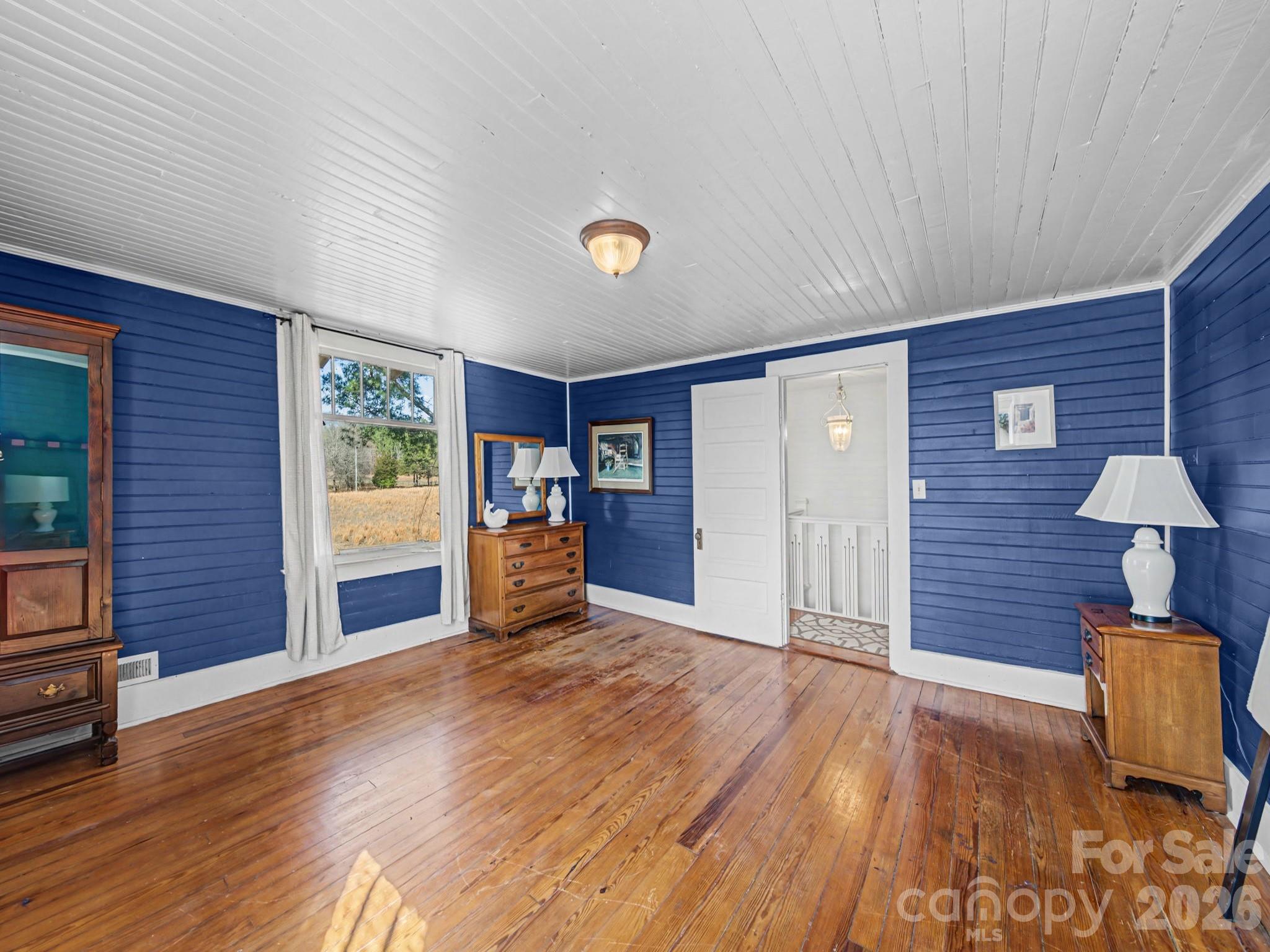 1347 Newsom Road Denton, NC 27239 - Photo 37 of 47 a view of a livingroom with wooden floor and furniture