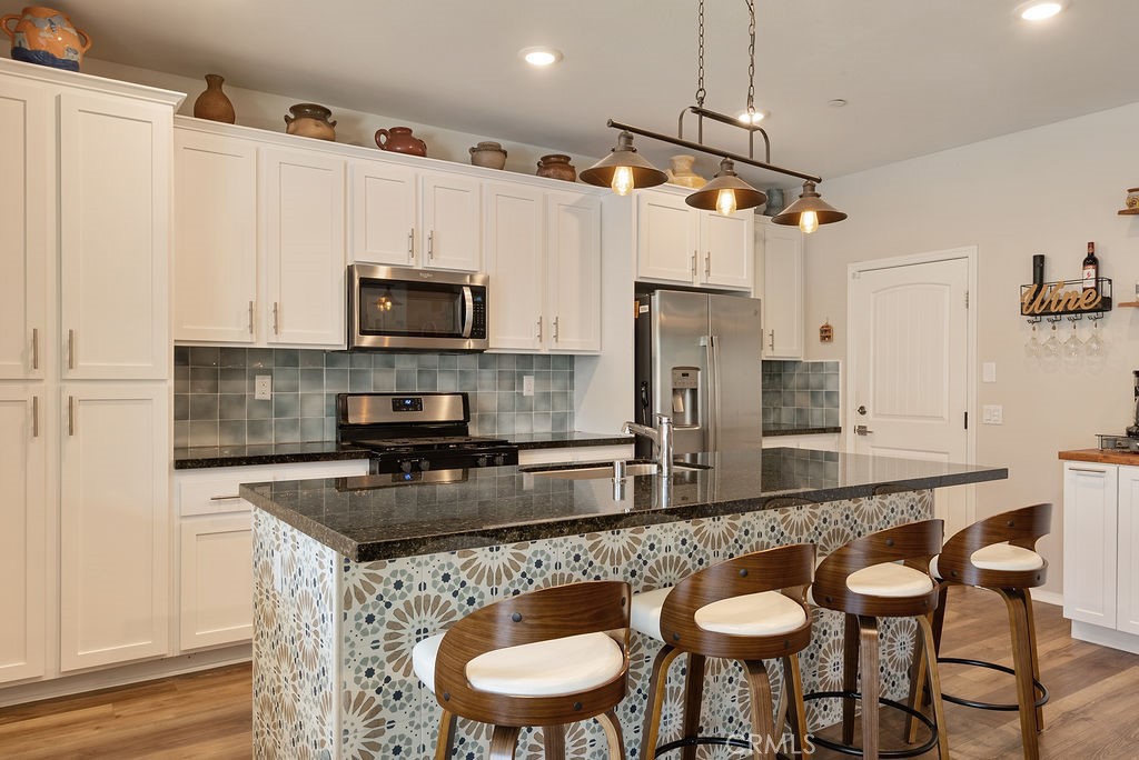 829 South Pine Avenue Rialto, CA 92376 - Photo 30 of 48 Custom island with Spanish tiling.