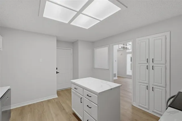 a kitchen with a stove and a refrigerator