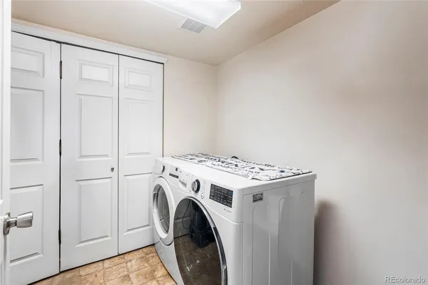 a utility room with dryer and washer