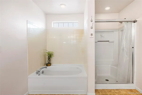 a view of a room with a ceiling fan