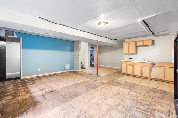 a bathroom with a toilet a sink and a shower
