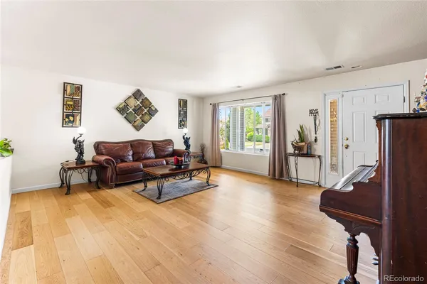 a living room with furniture and a table