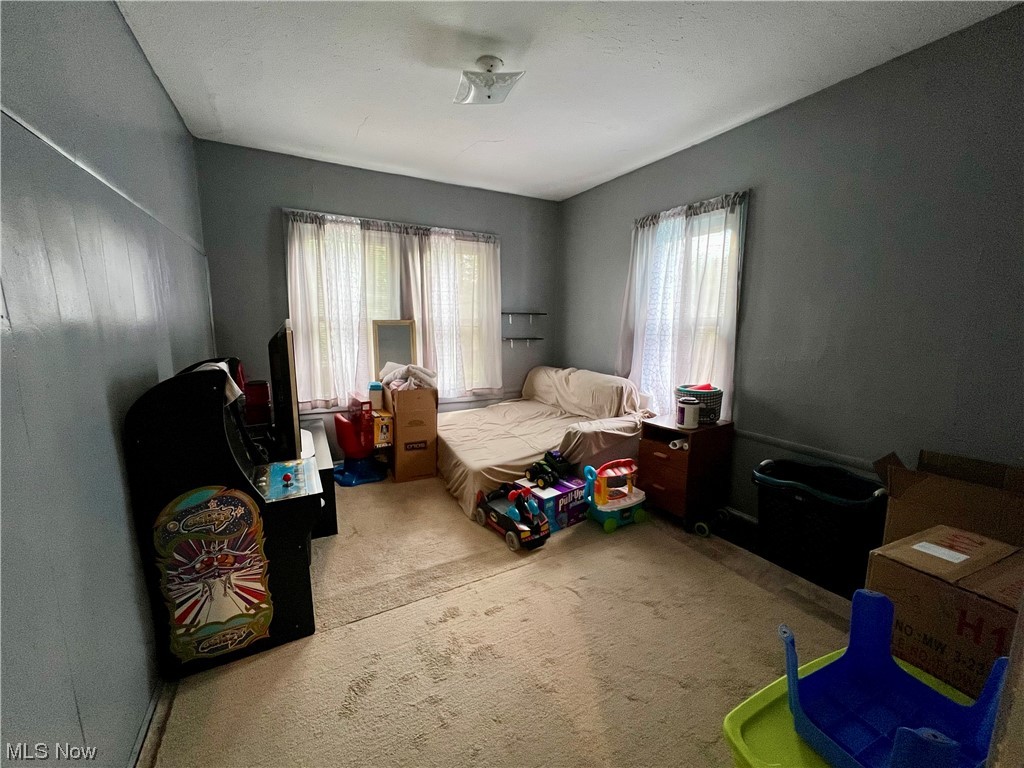 1761 Wayside Road Cleveland, OH 44112 - Photo 11 of 18 Carpeted bedroom with multiple windows