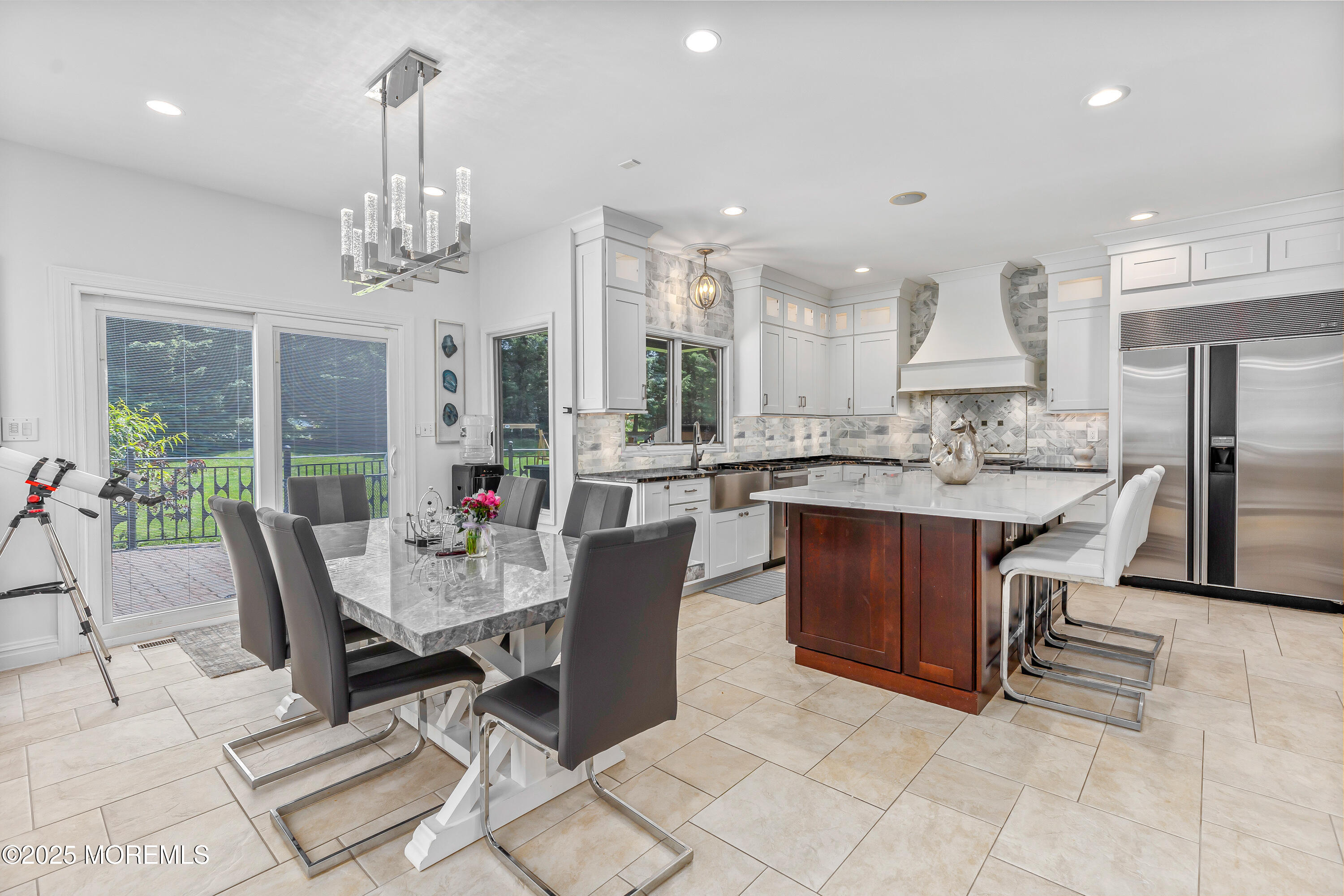 806 Turquoise Trail Morganville, NJ 07751 - Photo 11 of 62 a large kitchen with a table and chairs