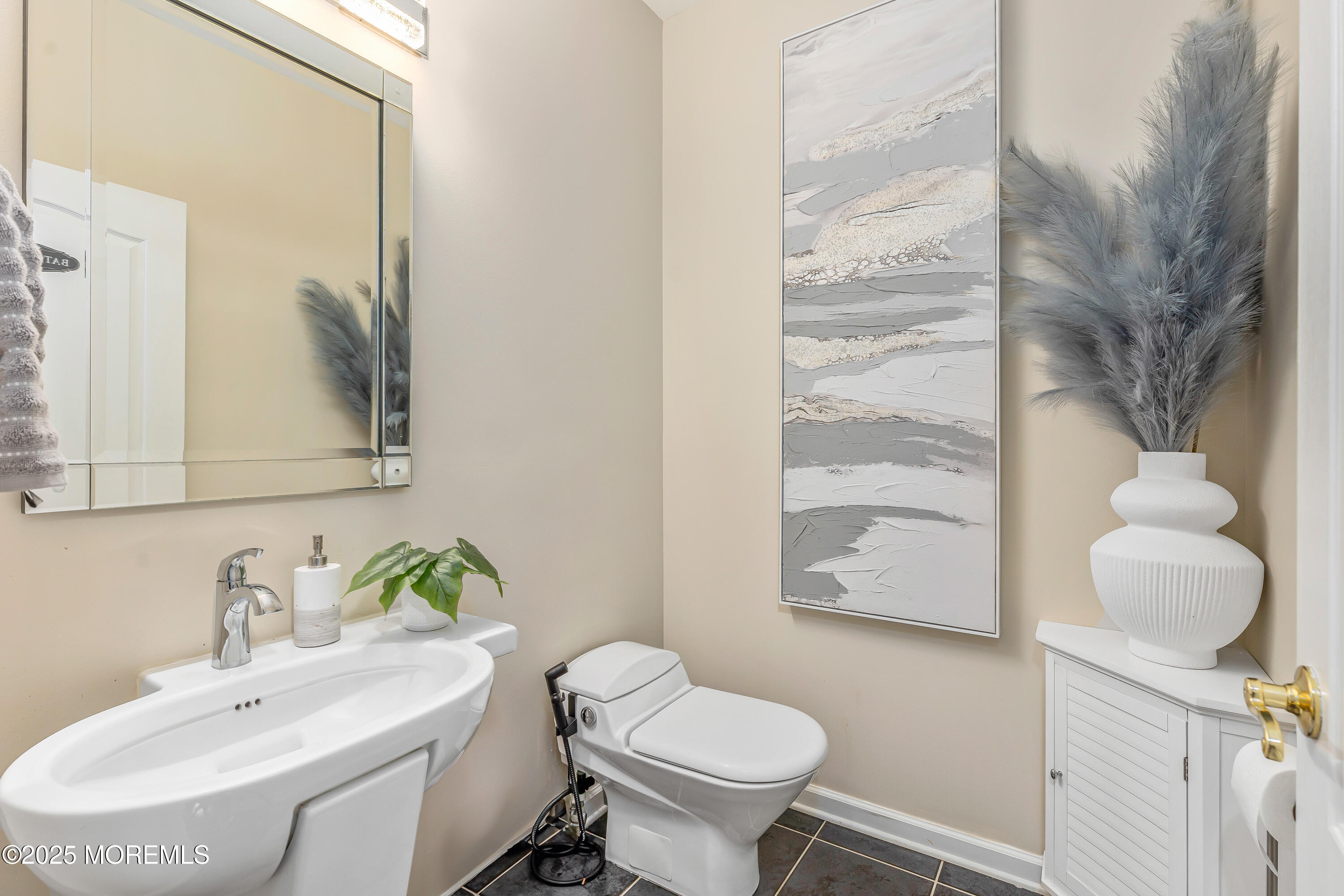 806 Turquoise Trail Morganville, NJ 07751 - Photo 16 of 62 a bathroom with a toilet sink and mirror