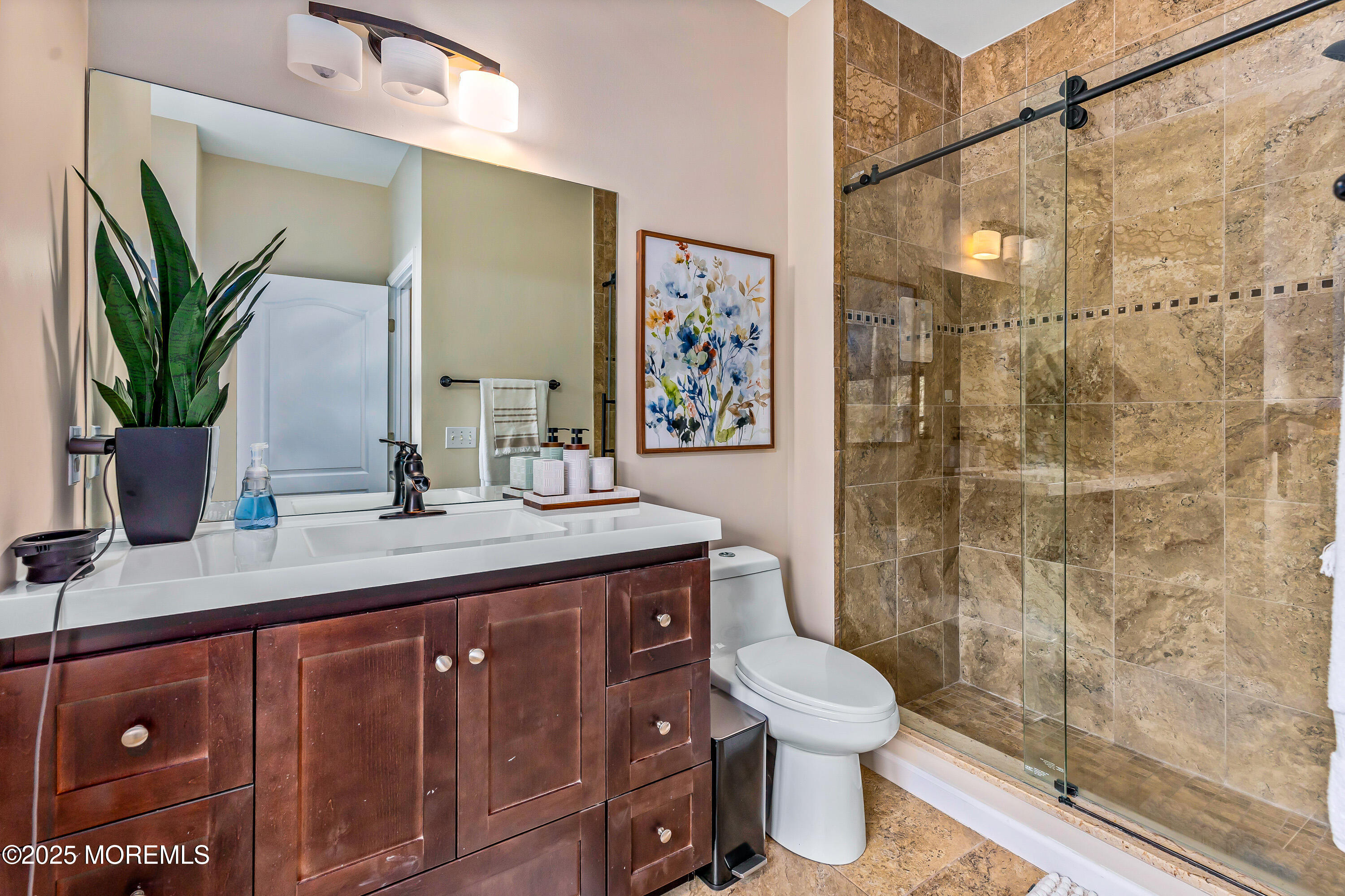 806 Turquoise Trail Morganville, NJ 07751 - Photo 18 of 62 a bathroom with a granite countertop sink a toilet and shower
