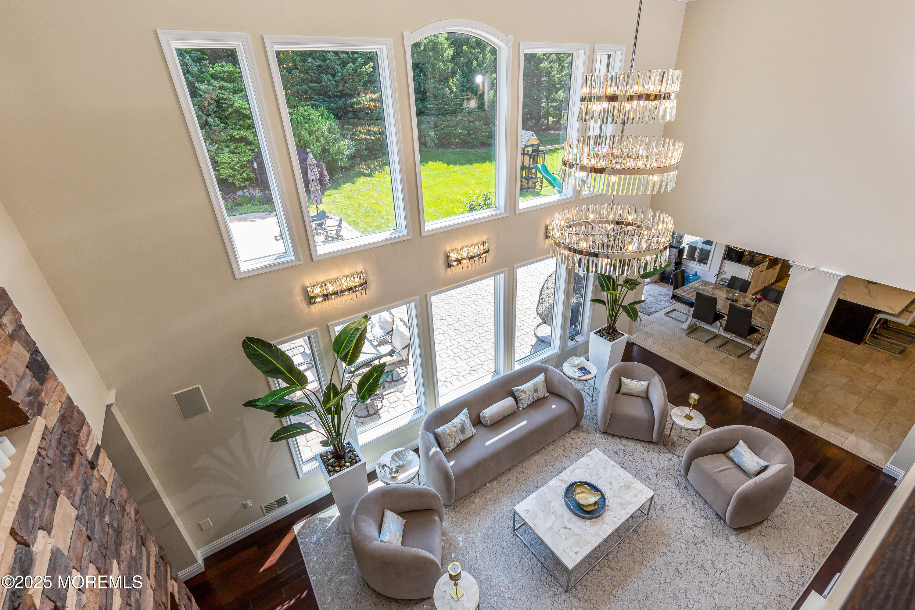 806 Turquoise Trail Morganville, NJ 07751 - Photo 19 of 62 a living room with furniture and a floor to ceiling window